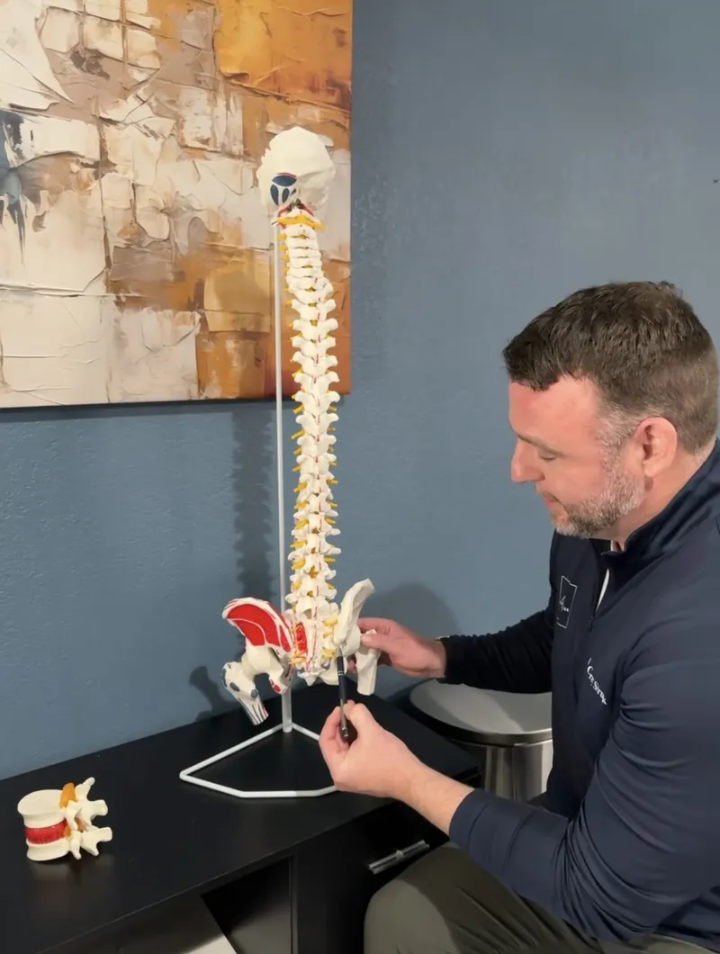 Dr. Corey explaining spinal anatomy for personal injury care